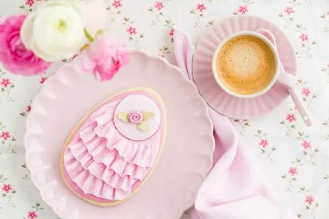 Big Easter eggs sugar cookie with fondant rose and pink ruffles, flower and a cu Stock Photos