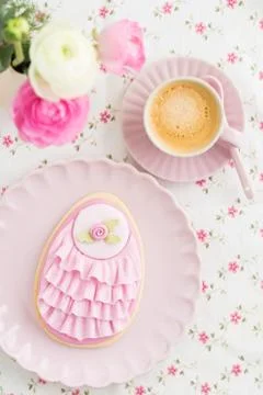 Big Easter eggs sugar cookie with fondant rose and pink ruffles, flower and a cu Stock Photos