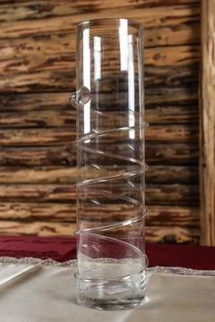 A big empty glass vase on the table Photos