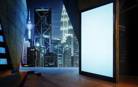 Big empty screen billboard with modern city background . Stock Photos