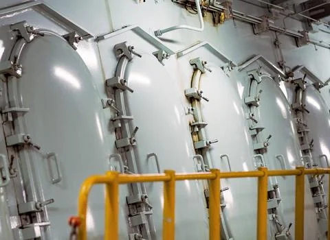 Big engine propeller inside a merchant vessel Stock Photos
