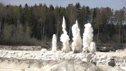 Big explosions from the limestone quarry Stock Footage 81194488