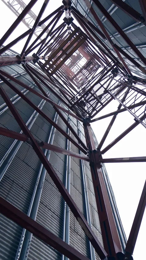 Big factory elevator construction. Storage granary technology tank. Vertical Stock Footage 317938763