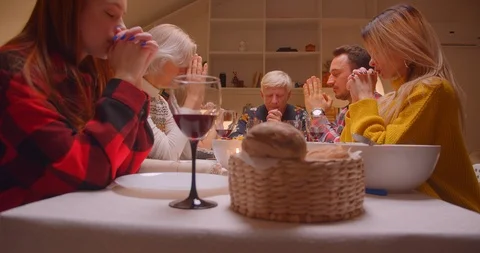 Big family dinner prayer together reunio... | Stock Video | Pond5