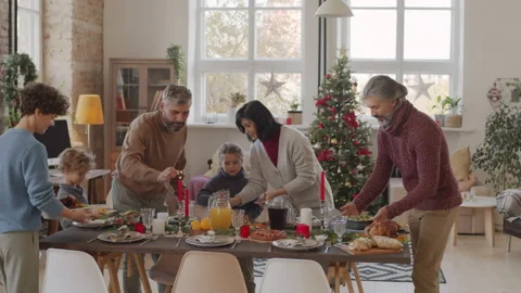 Big Family Setting Dinner Table on Christmas Stock Footage 142360886