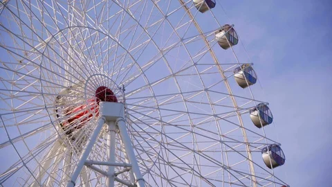 Big Ferris wheel on background of blue sky in the warm summer evening. Stock Footage 110596042