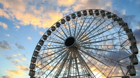 Big Ferris wheel time lapse against colorful sunset sky at dusk Stock Footage 150511562