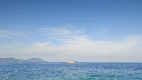 Big ferry is floating far on blue waves in open sea behind red Video stock 114690092