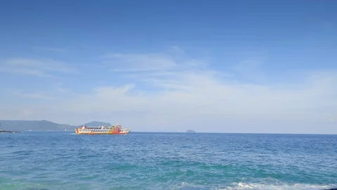 Big ferry is floating from harbor on blue waves Stockbeeldmateriaal 114690140