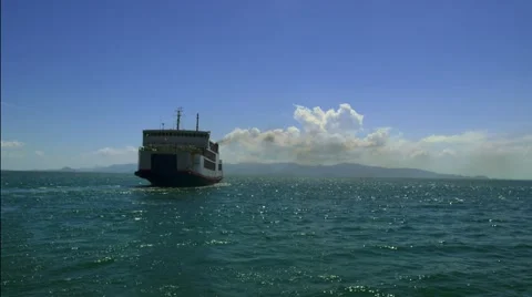 Big ferry ship with thai flag turning at the sea and sails to the horizon Stock Footage 60621555