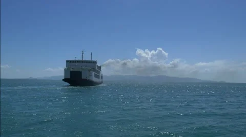Big ferry ship with thai flag turning at the sea and sails to the horizon Stock Footage 60621570