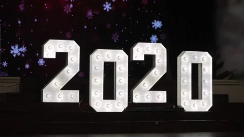 Big festive new year figures 2020, snowflakes on the background Stock Footage 142197979