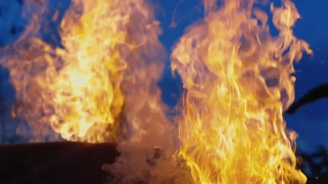 A big fire, firewood and garbage are burning. There was a fire at night Stock Footage 250028193