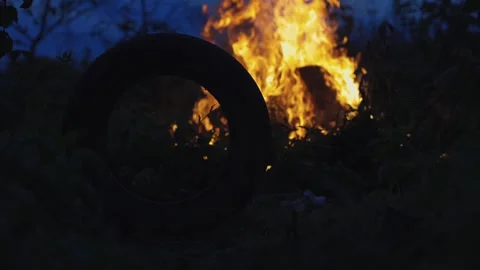 A big fire, firewood and garbage are burning. There was a fire at night Stock Footage 250028273