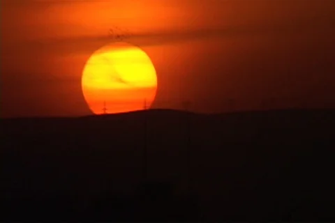 Big fireball sun setting on horizon. Stock Footage 86753213