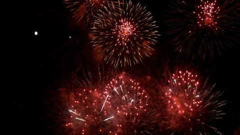 Big fireworks explode next to the moon 스톡 동영상 87021083