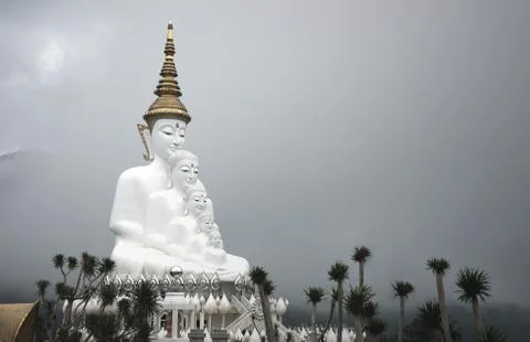 Big five white Buddha statue on cloudy sky background at Wat Phasornkaew temp Stock Photos