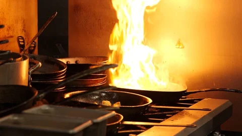 Big flame on the pan. A lot of kitchenware Video stock 127601713