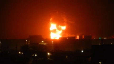 Big Flames Burning Building At Night With Fire Trucks And Hoses Spraying Wate Stock Footage 88939177