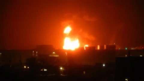 Big Flames Burning Building At Night With Fire Trucks And Hoses Spraying Wate Stock Footage 88939199