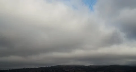 Big Fluffy Clouds Clearing Over Mountains Blue Sky Timelapse 4K Stock Footage 113935098