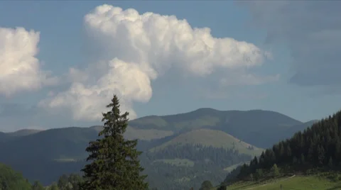 Big fluffy clouds float over Carpathian Mountains, summer day, time lapse Stock Footage 34970304