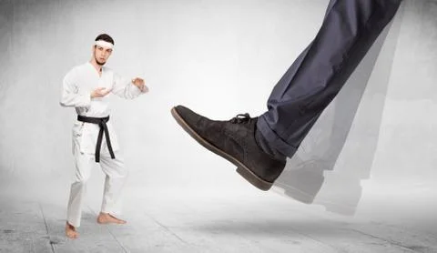 Big foot trample karate trainer concept Stock Photos