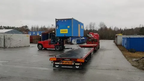Big Forklift loading construction barrack Stock Footage 143014162