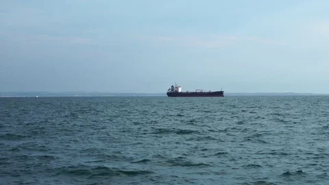Big freight container cargo ship oil tanker vessel sailing slowly in calm ocean Stock Footage 95321333