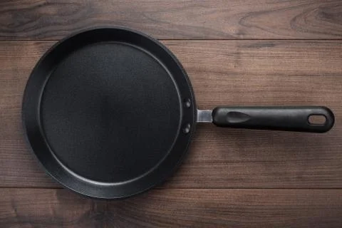 Big frying pan on the table Stock Photos