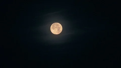 Big full moon with an orange tint in the night sky Video stock 126884541
