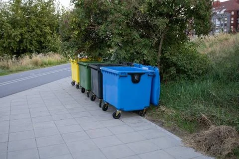Big garbage sorting containers on the street Stock Photos