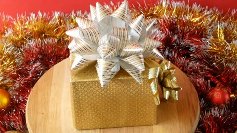 Big gift box with ribbon bow rotation, merry chirtmas and happy new year conc Stock Footage 139764974