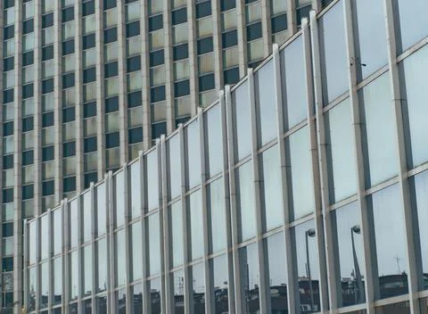 Big glass windows on a modern arhitecture building, geometrical pattern Stock Photos