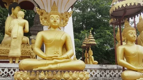 Big golden Buddha statues in different poses, Sisaket Museum, Vientiane, Laos Stockbeeldmateriaal 75553852