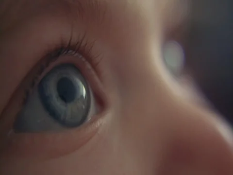 Big gorgeous baby blue eyes staring in the distance Stock Footage