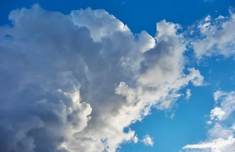 Big gray cloud in the blue sky Stock Photos