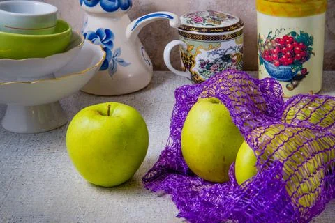 Big. Green apples on the kitchen table. Stock Photos