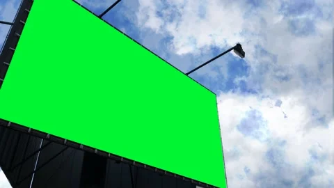 Big green billboard on the side of the screen against the sky. Keying. Mockup Stock Footage 190454667