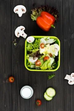 Big green box is completed with fresh salad Stock Photos
