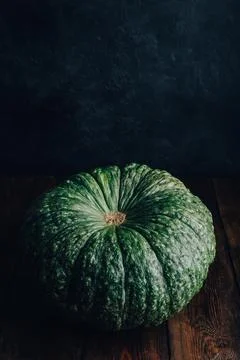 Big green pumpkin on table Stock Photos