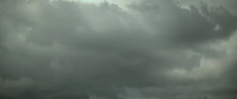 Big grey puffy cloud passing by cinemascope Stock Footage 242792759