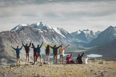 Big group of happy hikers in mountains Stock Photos