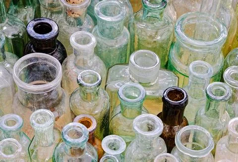 Big group of small empty glass bottles, aged and dusty Stock Photos