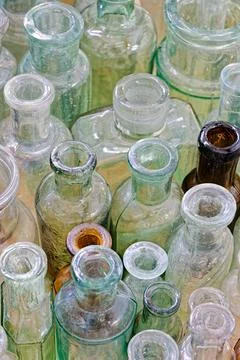 Big group of small empty glass bottles, aged and dusty Stock Photos