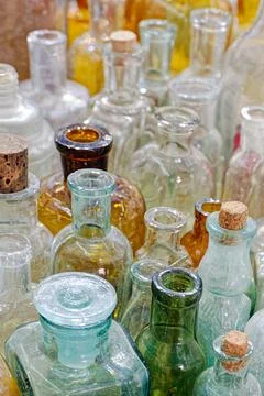 Big group of small empty glass bottles, aged and dusty Stock Photos