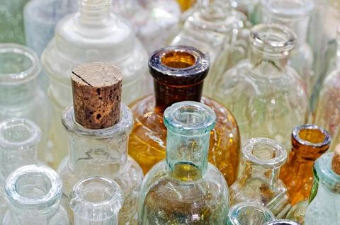 Big group of small empty glass bottles, aged and dusty Stock Photos
