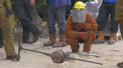 Big Group of Workers is Engaged in an Iron Meltdown Stock Footage 64381717