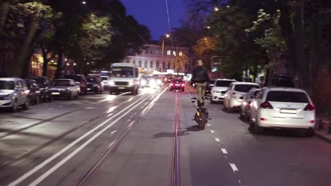 Big guy on motorcycle making stunt riding in the city standing on seat in the Видео 146751831