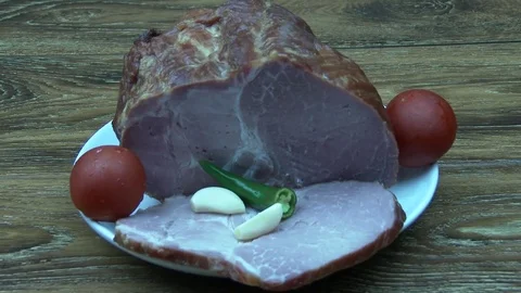 Big ham on the plate Video stock 79311595